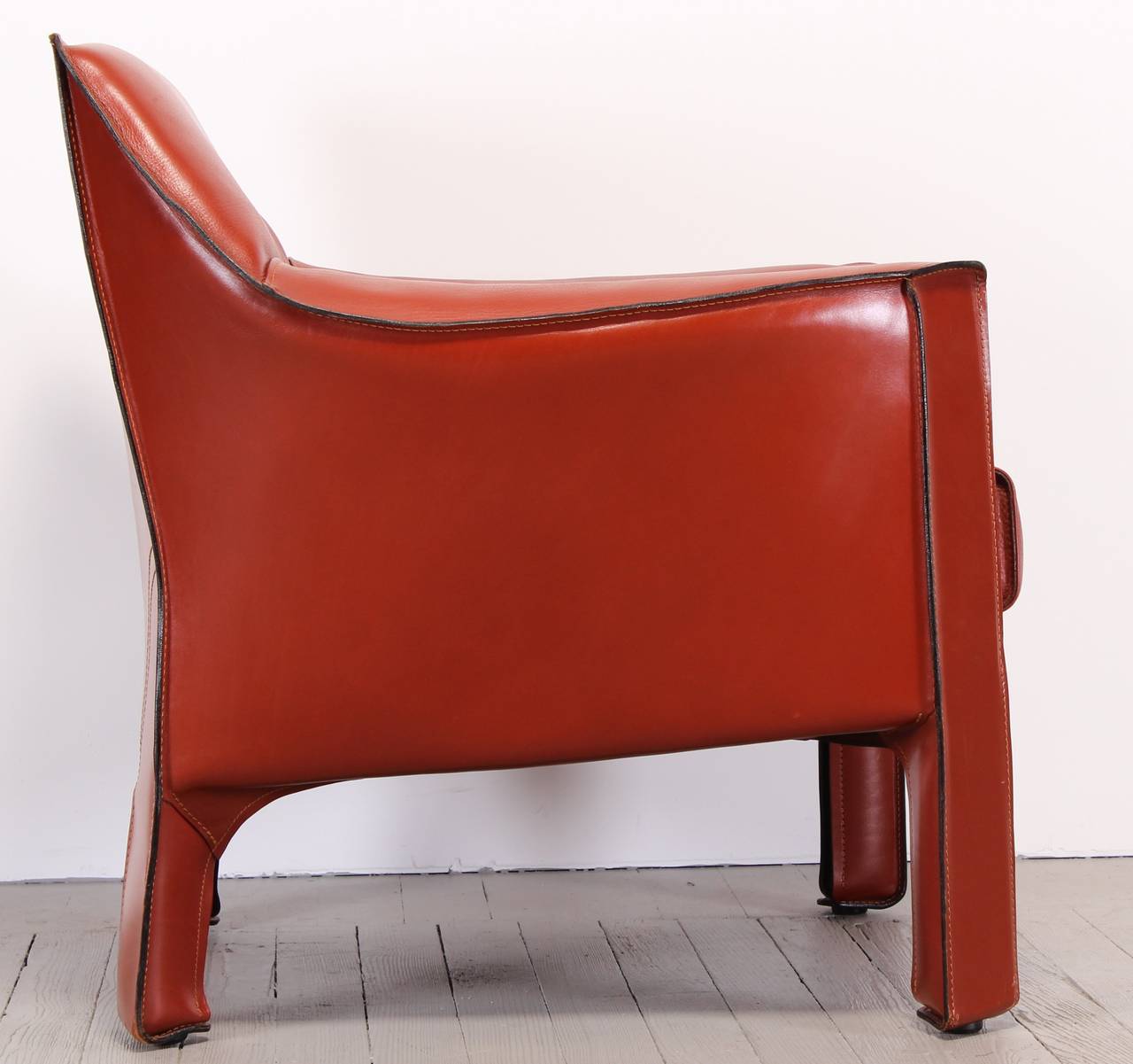 A great 415 cab chair by Mario Bellini for Cassina in soft Hermes toned reddish orange leather.