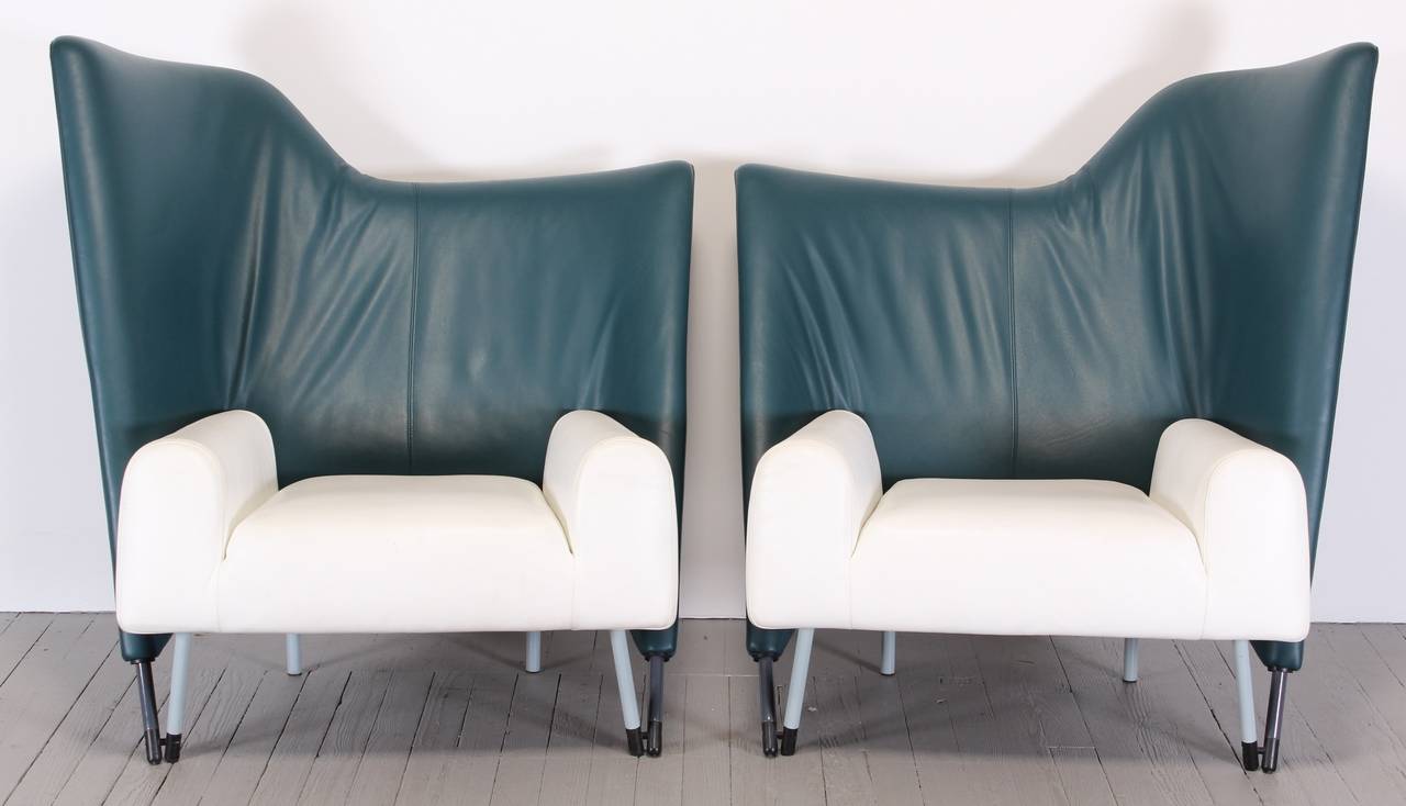 Pair of opposing asymmetrical armchairs made by Cassina. Architectural statement chairs designed by Italian architect Paolo Deganello. New upholstery suggested some scratches. 