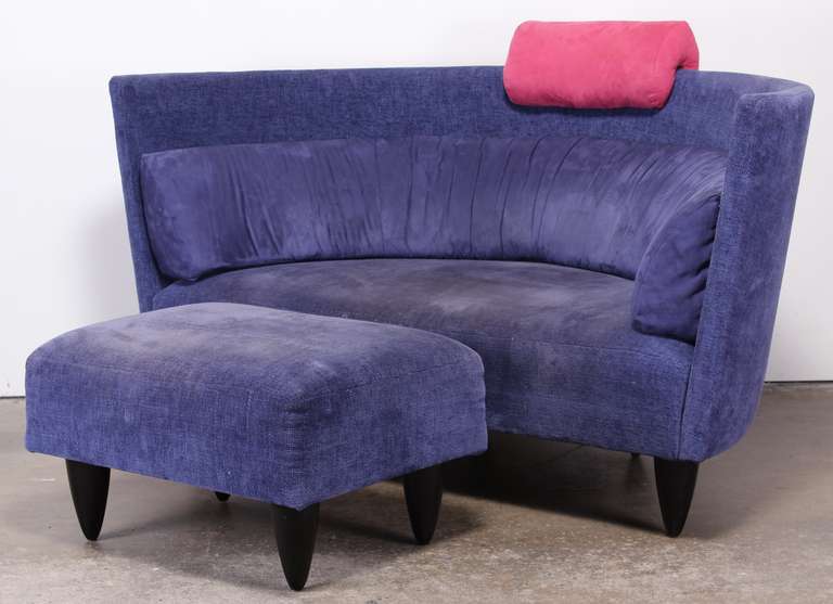A 1980's Italian post modern demi lune sofa and foot stool. This is a whimsical ultra mod set that will look great reupholstered.