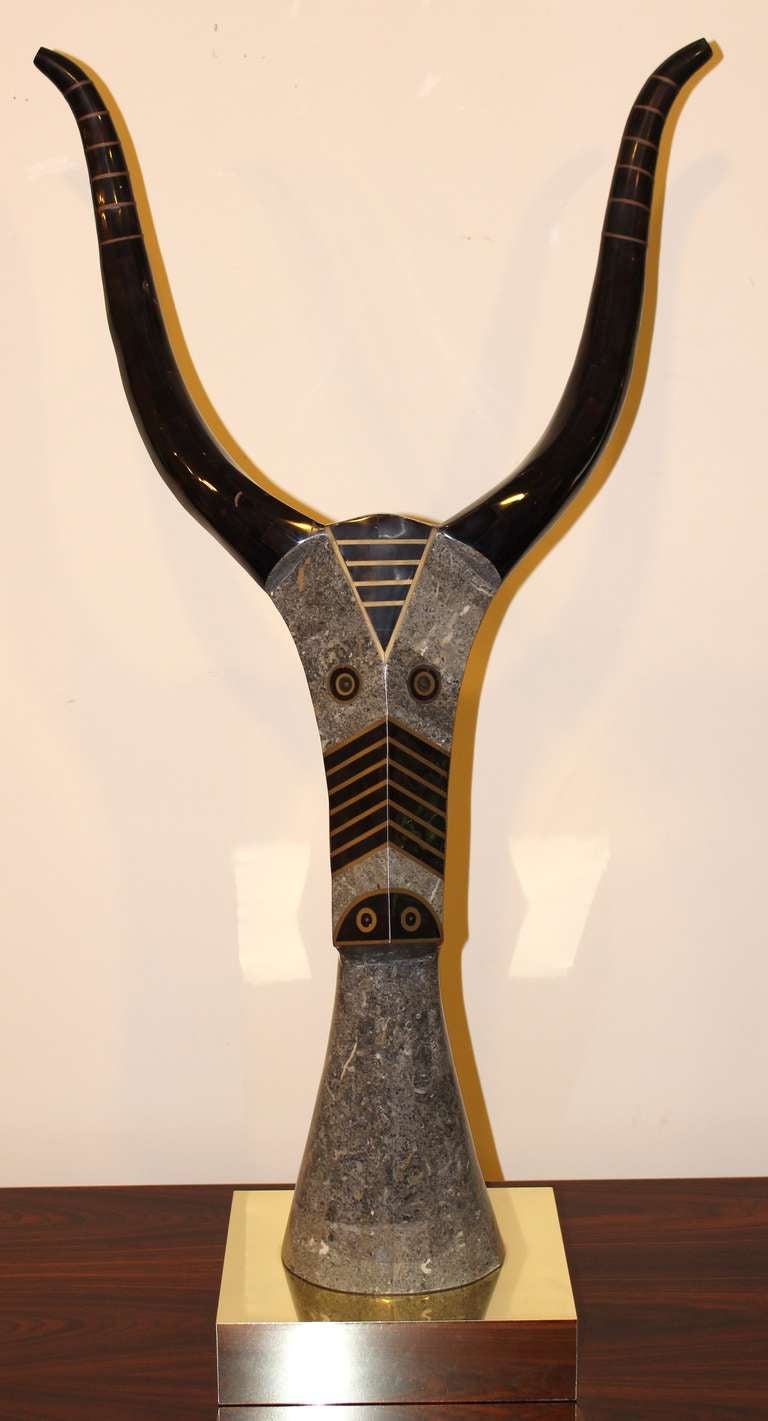 Tessellated stone, horn and brass inlaid antelope sculpture.