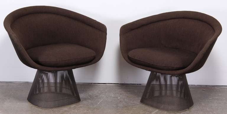 A classic pair of Warren Platner designer lounge chairs in sculptural bronze frame. Vintage fabric and foam. They need to be reupholstered. Frames are in excellent vintage condition.