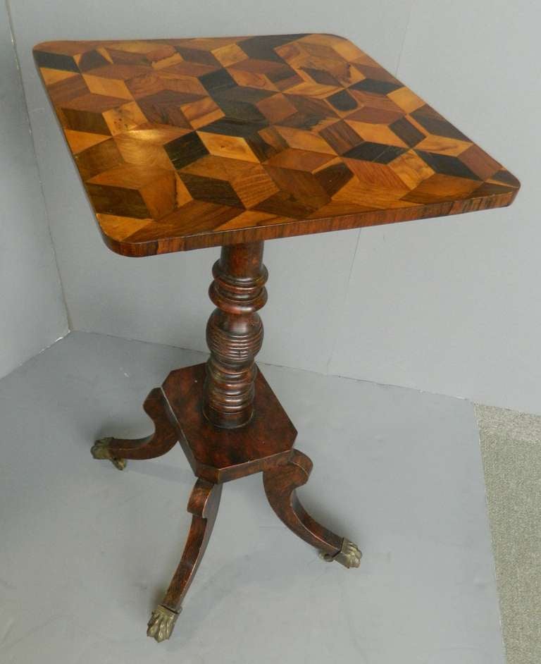 English parquetry candle stand, grain painted turned column above plynth, for sabot legs with brass hoof sabots.