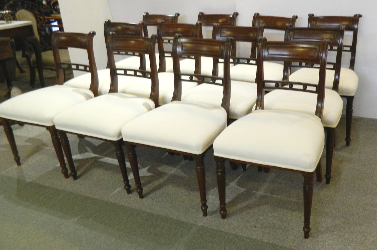 Set of 12 English Regency dining chairs, circa 1830.
Well made with an ample 19
