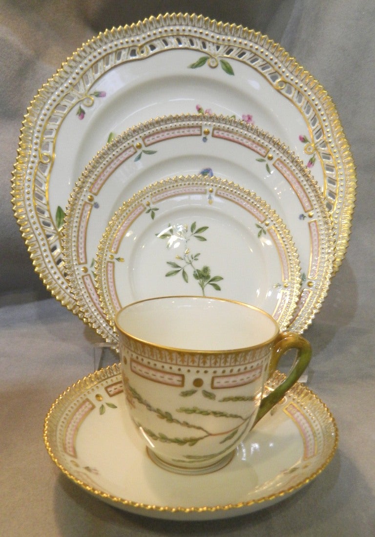 Eight five piece place settings of Flora Danica made by Royal Copenhagen. Included are-
eight 10