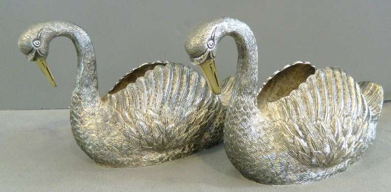 Pair of sterling hand engraved swan dishes with hand gilt beaks.  Made in London by C.J. Vander in the 1950's.  This well made pair weighs over 4 pounds.