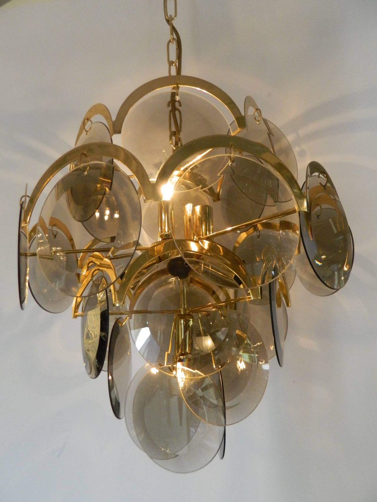 Murano glass seven-light chandelier with smoke colored beveled edge discs on brass frame attributed to Vistosi. Made in Italy in 1970s.