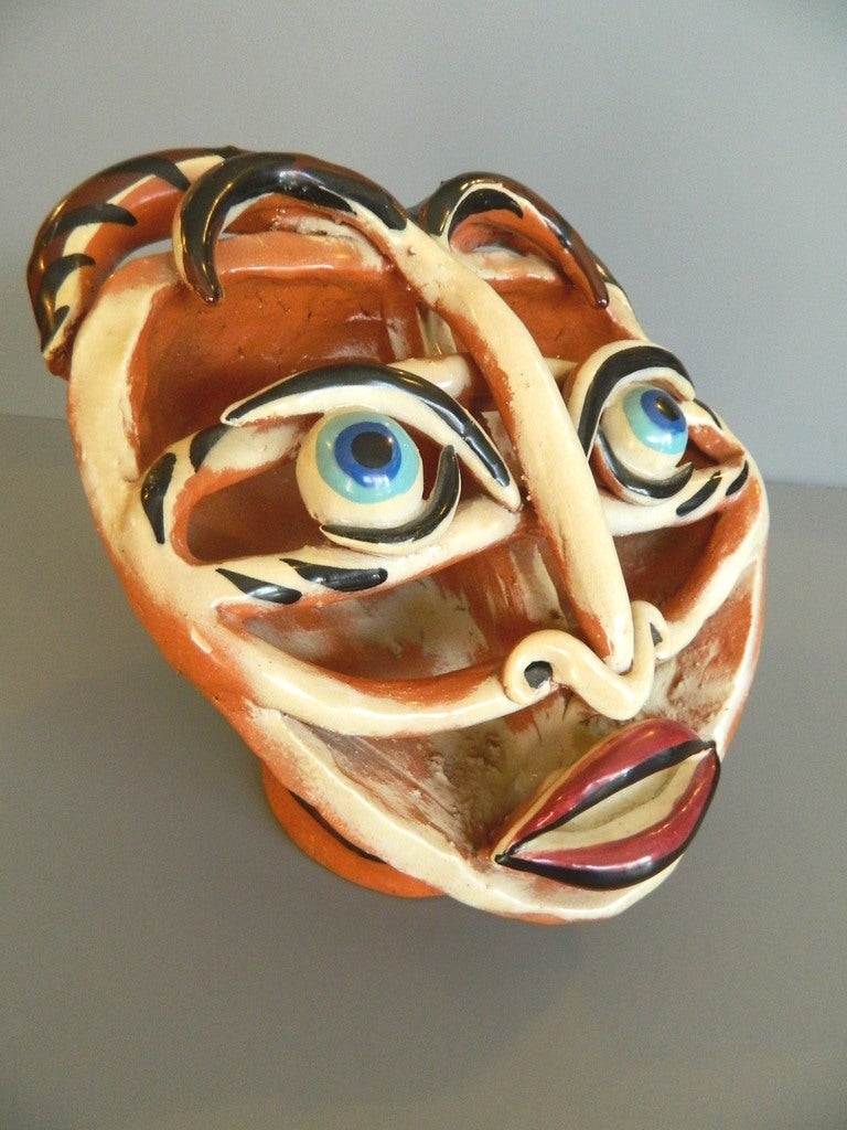 Great clay head hand modeled sculpture by Sascha Brastoff with an openwork face. It is signed on the base SASCH B. 
