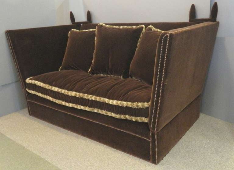 Tiplady Knole sofa made by the London firm George Smith covered in brown  mohair with three loose pillows trimmed in hair fringe.  The height to the top of the finial is 43