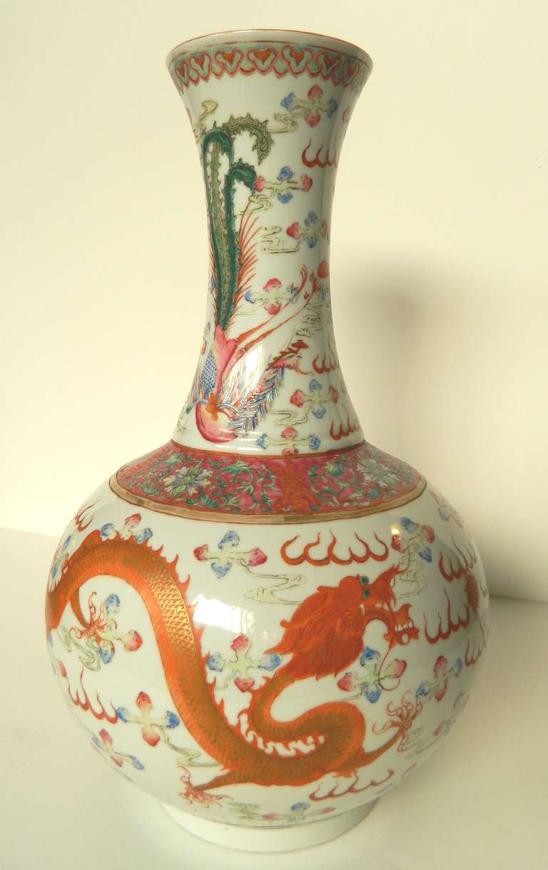 Chinese polychrome and gold enamel vase with dragon and phoenix decoration separated by a band of lotus scroll motifs. Qing Dynasty with Guangxu (1874- 1908) reign mark. Overall light wear giving a subtle soft color.