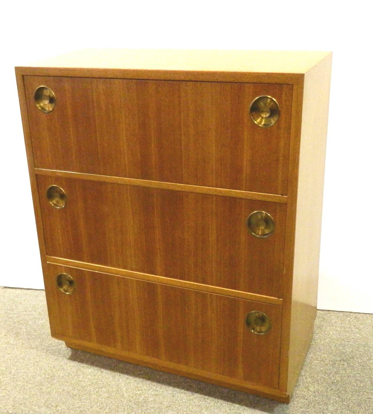 Group of four small three-drawer chests made by Dunbar, designed by Edward Wormley.
They are a subtle design with a slightly sloped front a 2 inch difference from top to bottom and inset metal handles. The can be used back to back to form a cube,