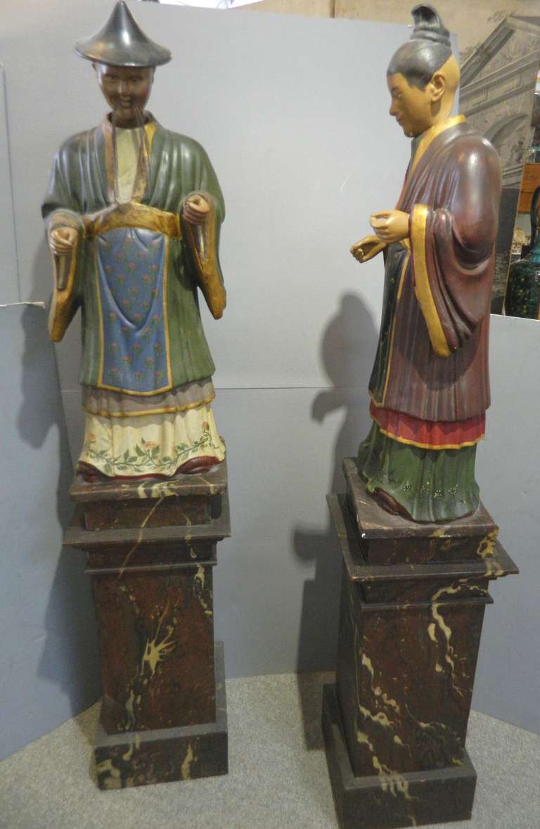 Antique pair large Chinoiserre nodding figures of a Chinese couple on faux marble painted bases. They are wood and plaster in two pieces. They were probably made in Europe at turn of the century.