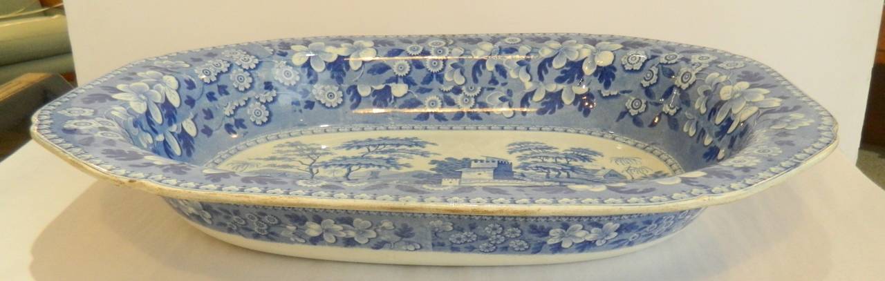 Huge antique Spode pearlware transfer hash dish in the Blue Tower pattern. Marked Spode in cobalt blue with incised Spode stamp and 12. It measures 21 inches long by 16.5 inches wide. Slightly irregular shape indicative of age, circa 1810.