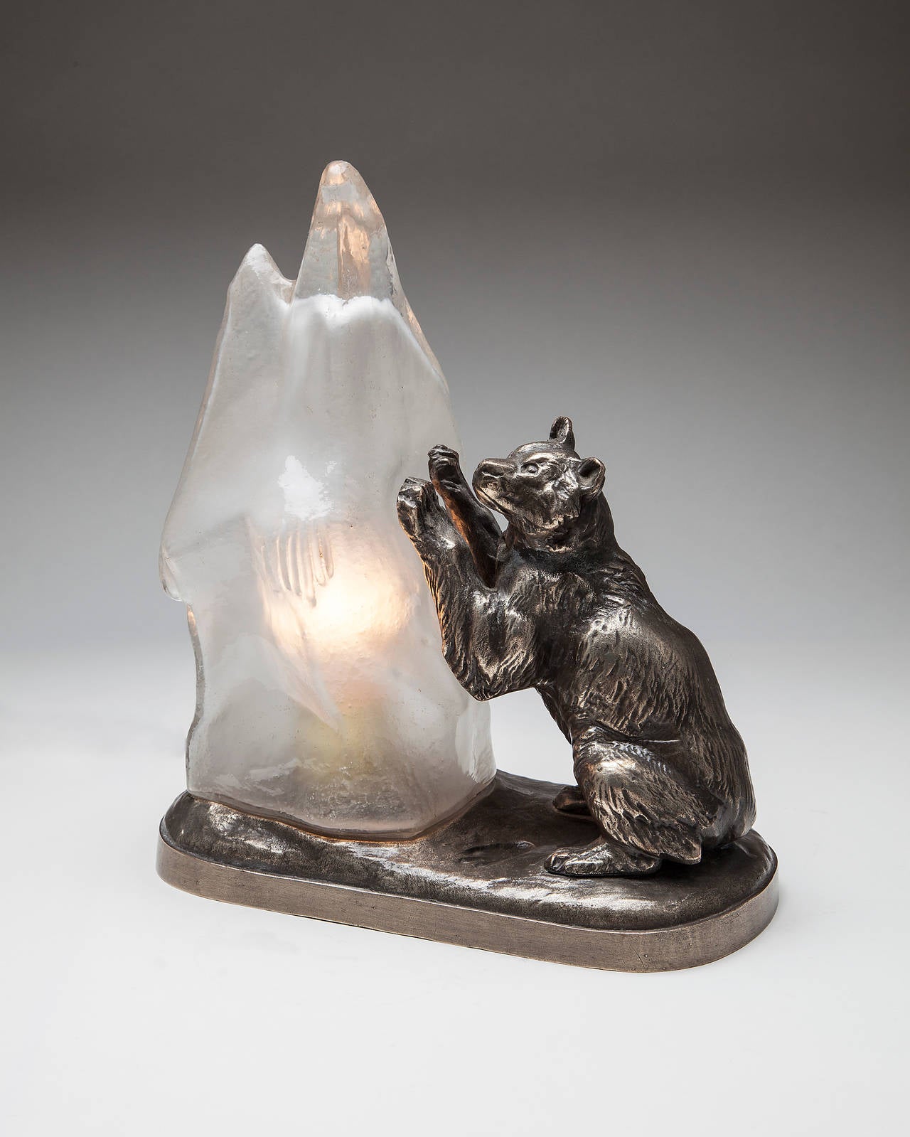 Charming pair of French metal lamps with polar bears playing with glass iceberg shades. Each is marked Paris Fabrication Francaise made in France on the back. Smaller one is also signed T. Cartier, circa 1930.
Dimensions: The largest one is 13