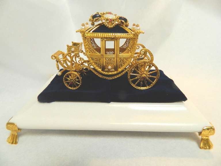 Authentic Igor Carl Faberge' Imperial Wedding Coach crafted in gold and silver set with rubies, diamonds, pearls and opal. This was created by Igor Carl Faberge', grandson of Peter Carl Faberge'. It is number 703 of a limited edition of 1500. The