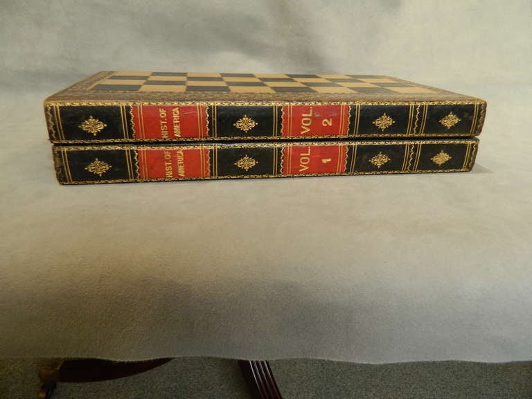 Leather covered folding game board/box with chess and checkers on the outside and backgammon inside with a great overall book design. The spine reads- Hist. of America Vol. 1 Vol.2. Late 19th century.