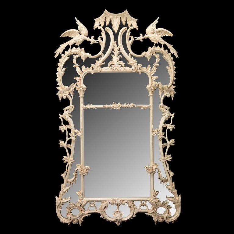 A fine Chippendale design foliate carved mirror with split central glass surrounded by swags and scrolls and carved acanthus decoration, having a paint finish. 

It is possible to commission this design in alternative finishes, responding to