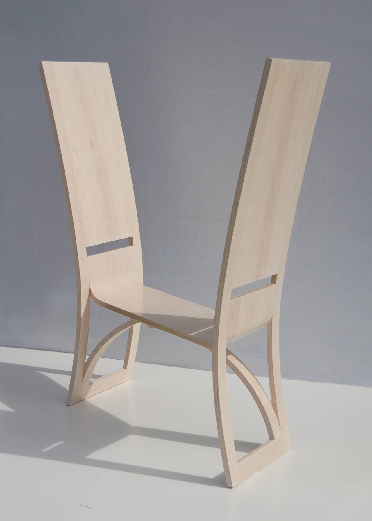 A collectible from award-winning designer Katie Walker. An elegant and deceptively simple form.
 
This piece plays on the dialogue between two separate chairs. Accordingly, if two people were seated one would have their legs to one side, the