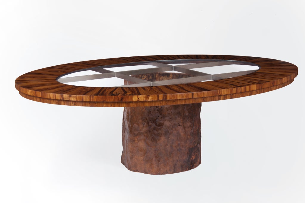 This table combines unique and rare parts. The oval top is made from laburnum, a timber that is rarely found in large enough sections to make the veneers used for this table.  Laburnam has a distinctive grain which here is simply enhanced with a