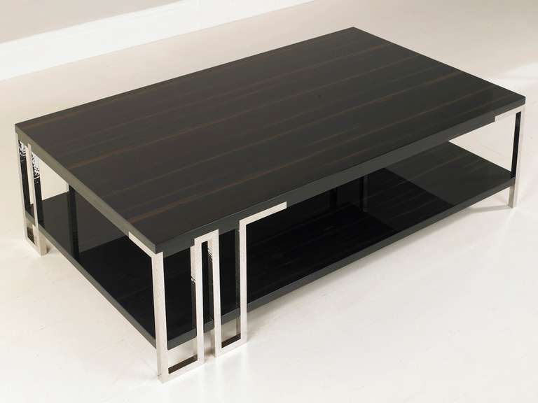 This coffee table having stainless steel legs that are worked with a subtle beaten effect.

The table exhibited as part of 'Inspired' - an exhibition at The Goldsmith's Centre in London, this being part of the 2014 Festival of Silver in which