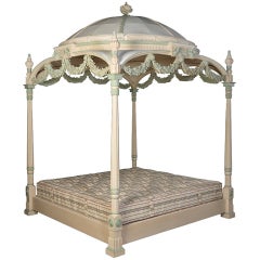 An exceptional four poster painted mahogany bed