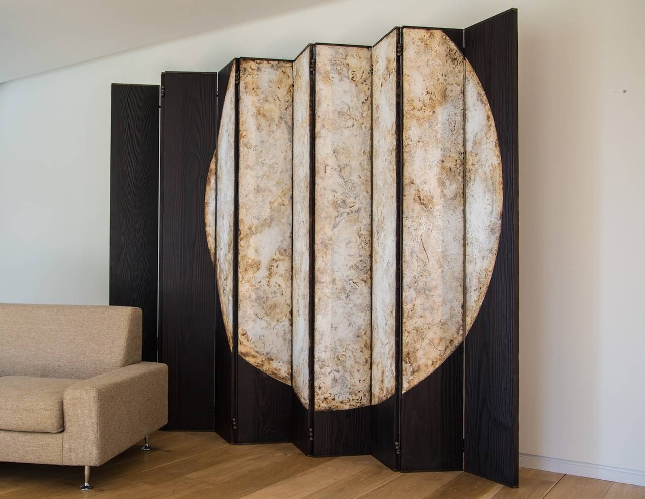 This screen is a conversation between bold, impactful design and richly textured, crafted surface. It is custom made in size, for floor standing or wall mounting. The artist is well known for his powerful Moon series of which this is one (detail