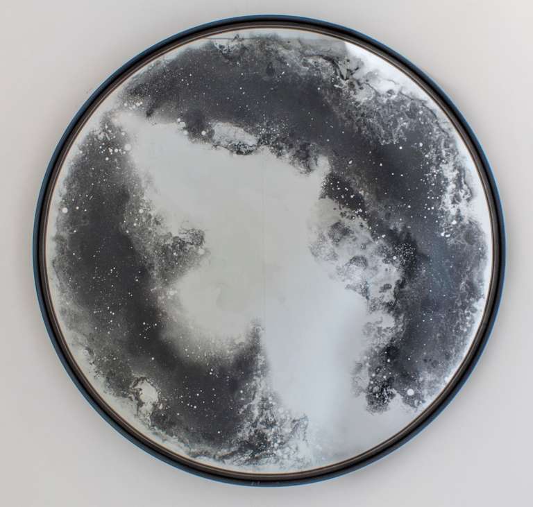 The spectacular mirror shown is of exceptional size at 120cm diameter. A unique means of hand silvering has been developed specifically where the liquid silver is manipulated to capture the swirling clouds of dust and stars. The deep blue black silk