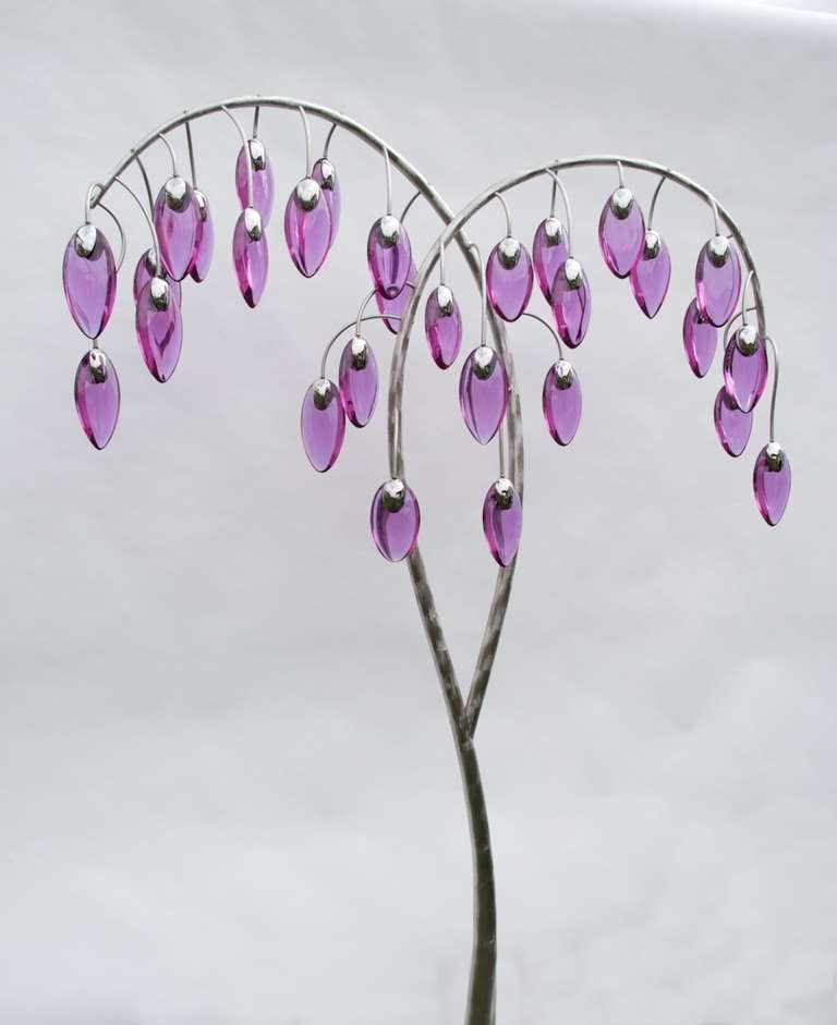 An inspired original design created by the celebrated British glass maker and sculptor Neil Wilkin. 

The stems are hand forged stainless steel tapered tubing with a ground textured finish. The 'fruits' are solid neodymium coloured lead crystal