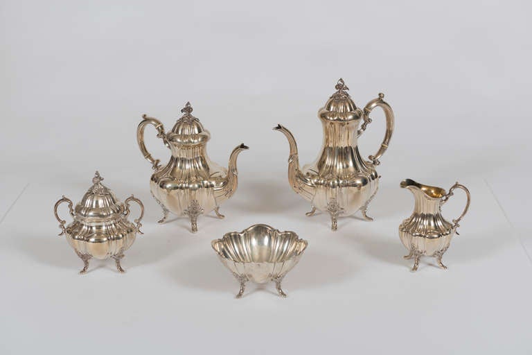 In the Bradford pattern; comprising coffee pot, tea pot, sugar bowl, creamer and open waste bowl.  No monograms.  Stamped with bell motif indicating 1951 date.