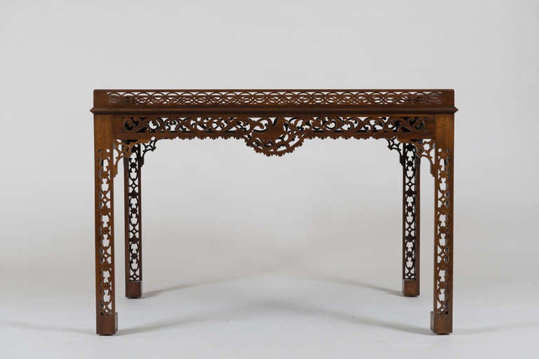 The rectangular top with pierced fret gallery over a pierced fretwork frieze and legs.