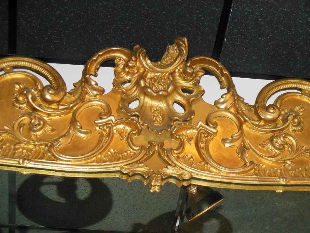 An American gilt Rococo Revival mantel mirror with 