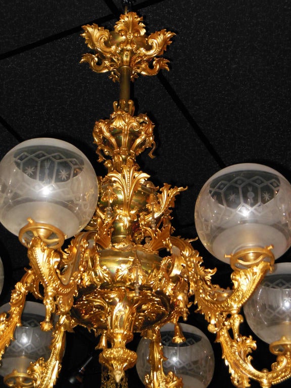 An American gilt brass Rococo Revival Gas chandelier, originally made for gas and now electrified with six authentic period frosted and etched globes, attributed to New York manufacturer Starr & Fellows.
 