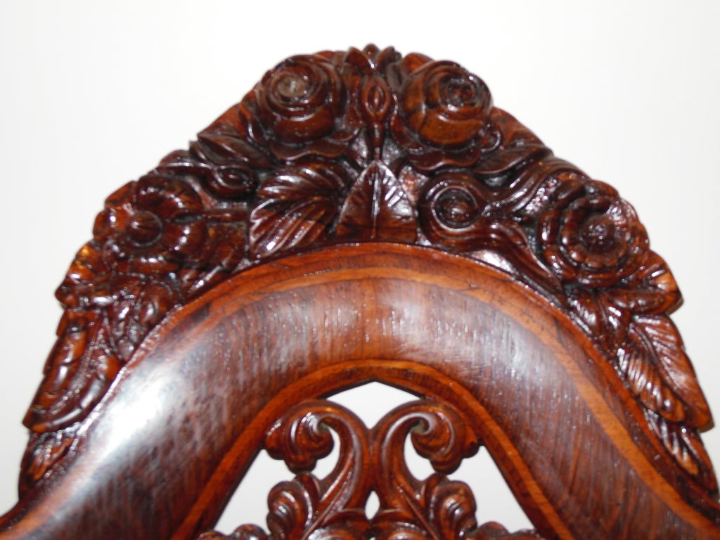 A laminated rosewood Rococo Revival slipper chair by John Henry Belter. He took out a patent for laminated furniture and his furniture is in all major American Museums. The chair has a Berlin work beaded seat.