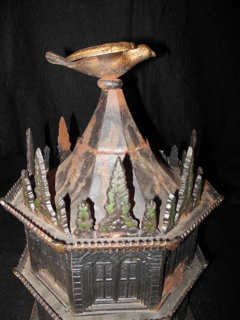 A cast iron Octagonal  bird house in the Gothic taste, an almost identical birdhouse was pictured in the show 