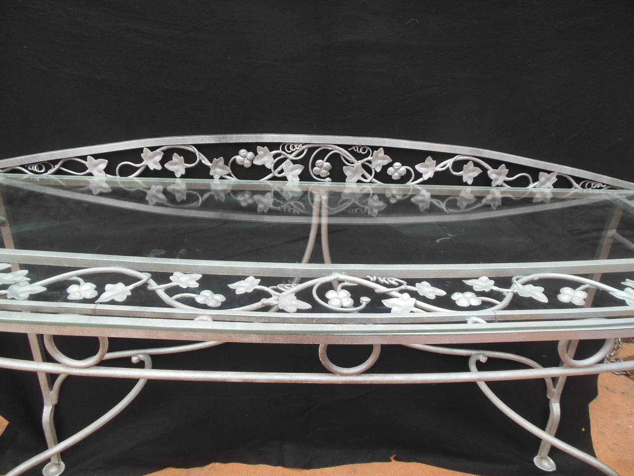 Important vintage wrought iron and glass console table by John Salterini. This exact table is shown in an early Salterini catalog and is called by the company "Park Ave Buffet." This is one of Salterini's most elaborate designs. This