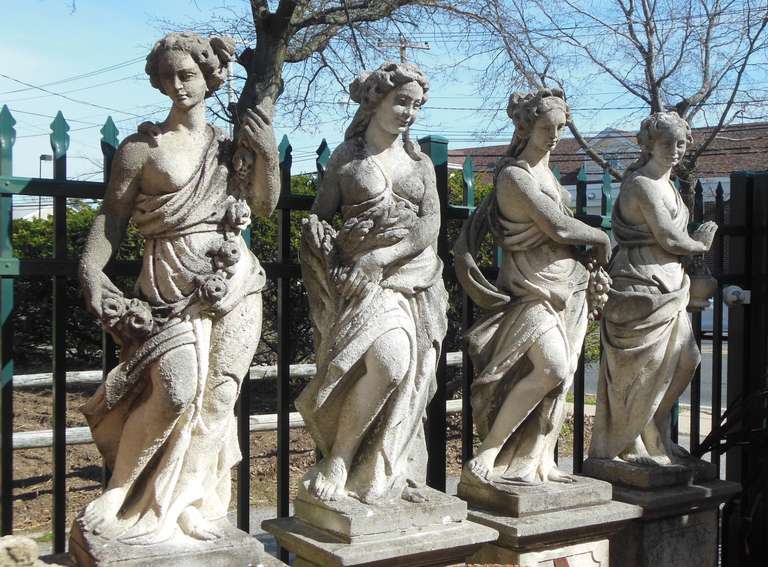 A classical set of statues in Cast Stone known as the 4 seasons. These statues  have been interpreted by many foundries and this is one of the loveliest 
American made sets on the market today. The statues graced a palatial 
Long Island Estate for
