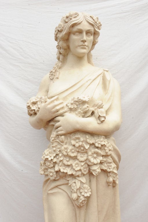 Surprise, this is a 20th century fiberglass classical subject of flora, she would be great in a conservancy or garden. Measures: 82" tall, base 21" x 22".