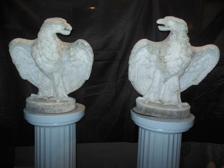 A pair of cast stone American eagles that are a facing one another. These would be wonderful on an entrance column, or on a pair of pedestals.