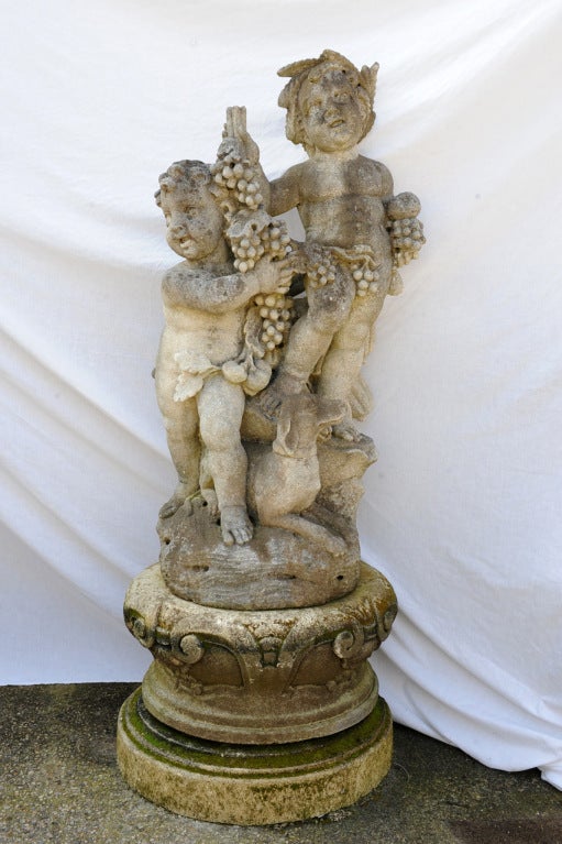 Elaborate Stone Figural Group, with  cherubs & Dog