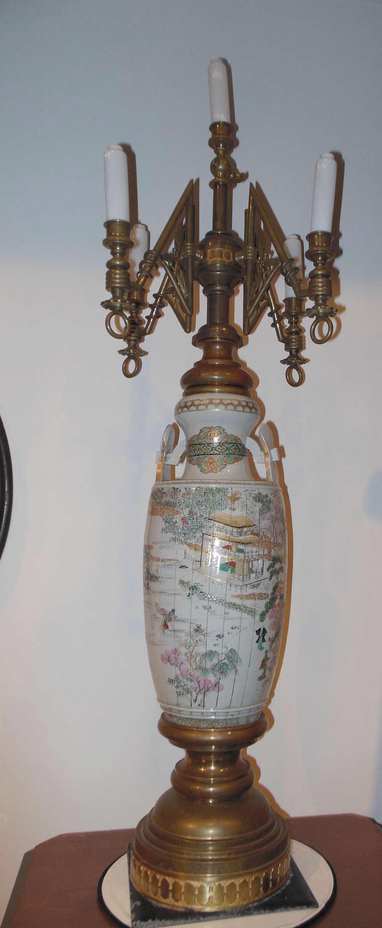 A large and rare Victorian Newel light in the aesthetic taste with a Satsuma porcelain central column, originally, made for gas and has not been converted to electricity. The lamp has five original glass candles. This lamp must have graced a