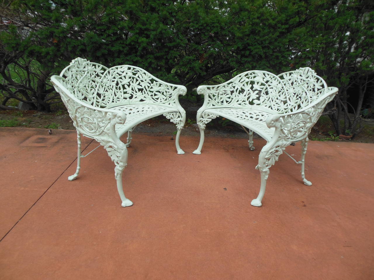 A  Pair of  Cast Iron Benches in the hard to find Passion Flower pattern. The benches in the rococo style, have been been totally restored and painted in a very light sage green. They had no breaks or repairs prior to painting and are still in