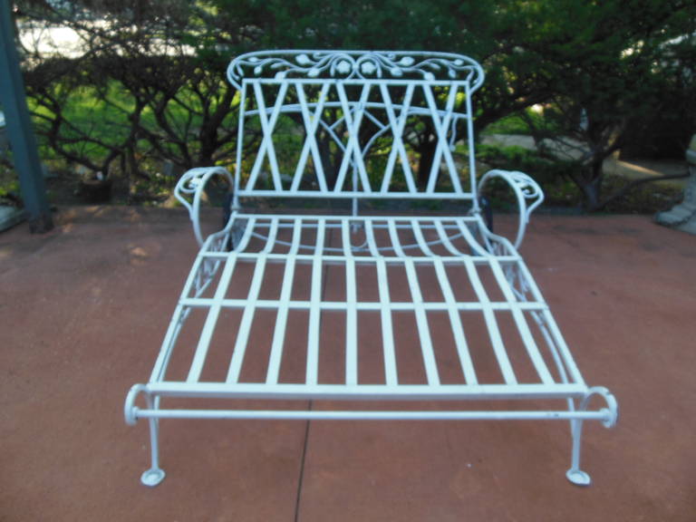 A Salterini wrought iron double chaise. The chaise is in great condition for
its age. The rubber is still on the tires, and the painted finish is usable with some minor touch ups needed. Also available is a matching single Salterini single chaise