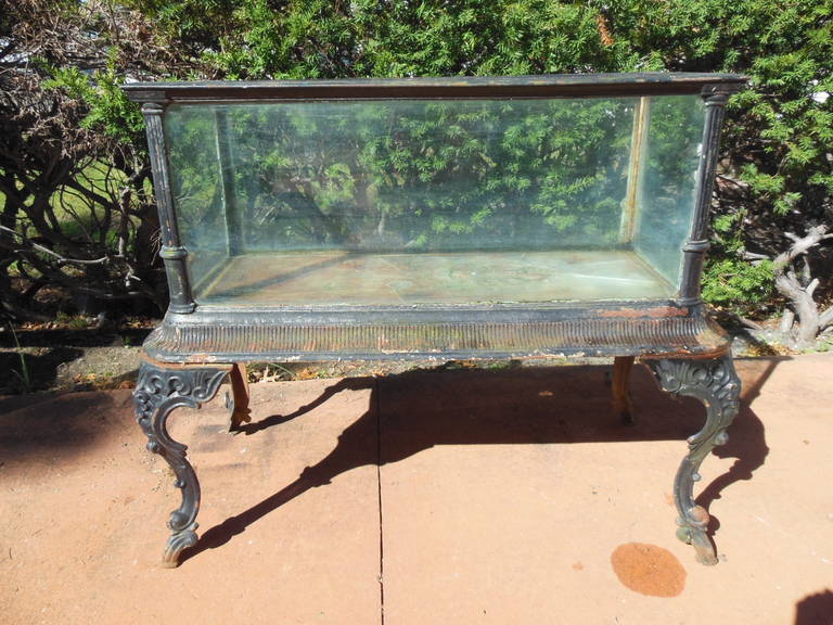 This is a J W Fiske Cast Iron Fish tank or aquarium. It is in original as found condition. I have decided not to paint and restore it as the buyer may prefer to do it themselves.
The base of the actual tank has 2 wholes, but those wholes cannot be