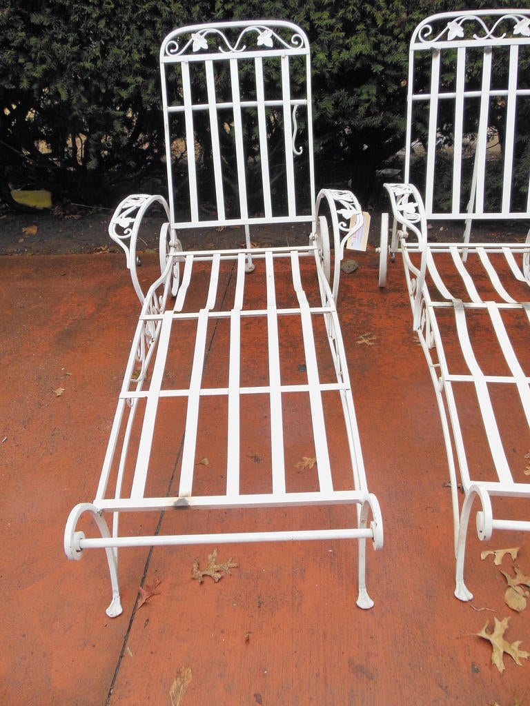 A wonderful pair of Salterini Chaise Lounges. These chaise lounges are in the desirable Mount Vernon Pattern and are hard to come by. 
Salterini was the premier maker of Wrought iron furniture in the USA in the mid 20thC