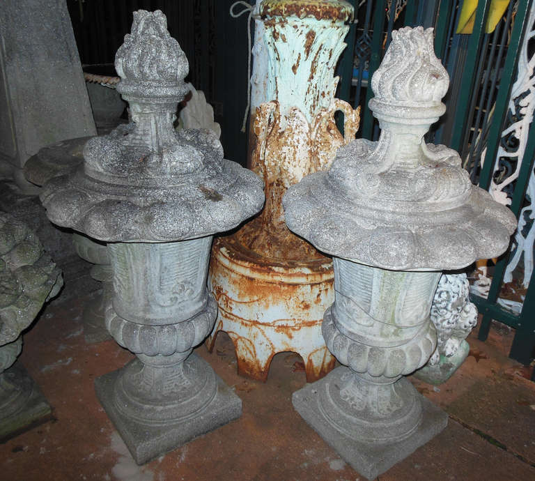 An exceptional pair of cast stone finials, 45