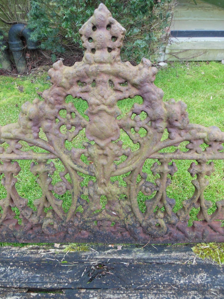 A 19thC Cast Iron garden bench in the “Gothic” pattern. Coalbrookdale registered this design bench in 1854 & Wood & Perot  [Phila] issued their design in 1858. Without a marking it is impossible to tell who the maker is.
The Bench was found on a 90