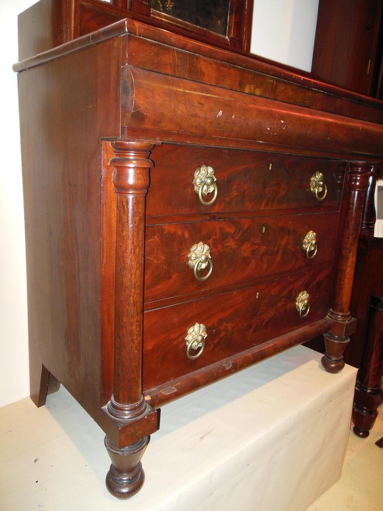 An important and rare 19th century American Classical mahogany dresser bearing the early and rare label of Meeks and Sons Manufacturers 15 & 45 Broad Street, New York. The piece is in absolutely original condition maintaining its original finish