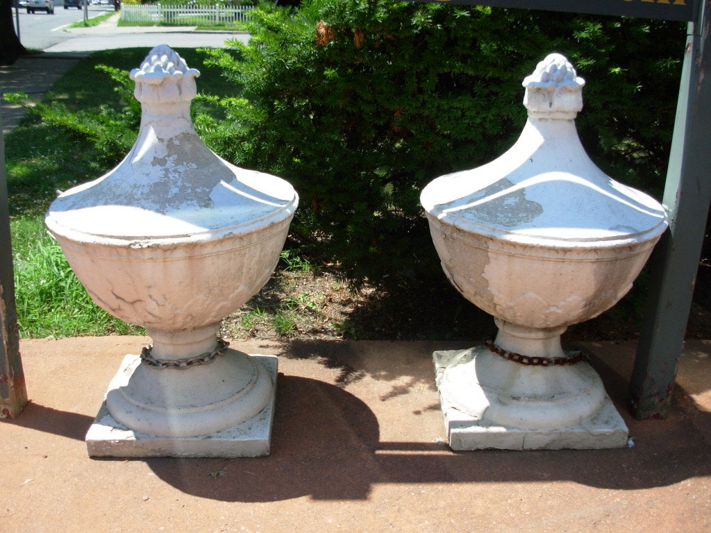 A large pair of cast stone garden finials originally from the former Victorian Hotel know as