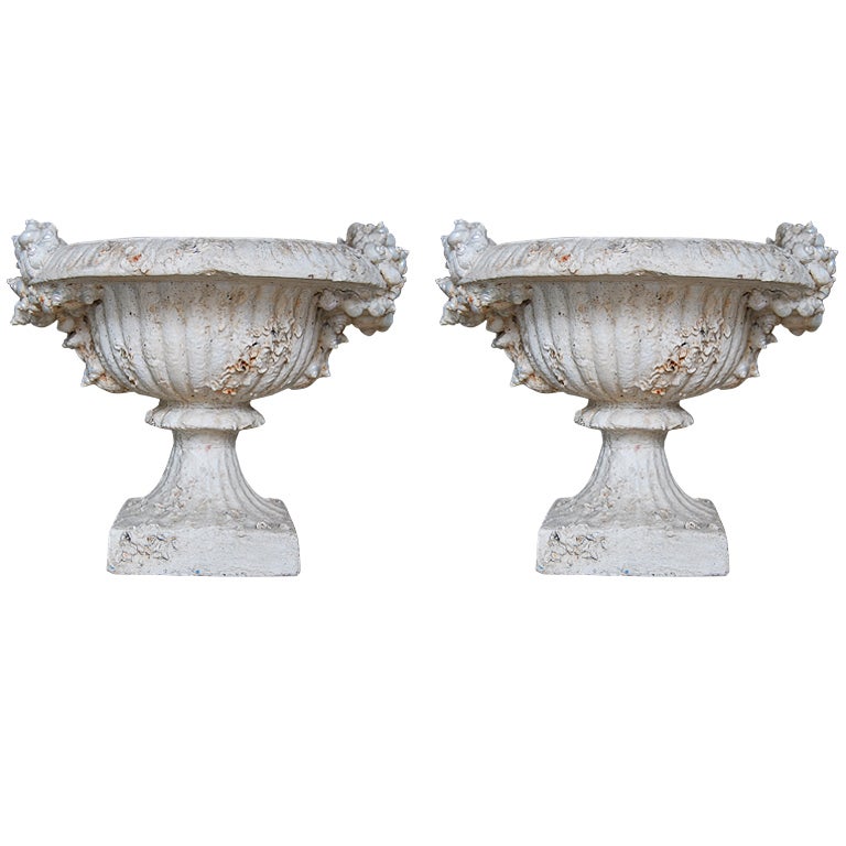 Pair of shell encrusted urns planters
