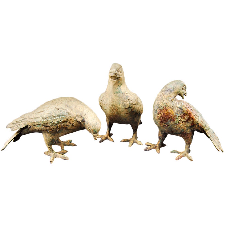 Set of three French cast-iron pigeons, 1950