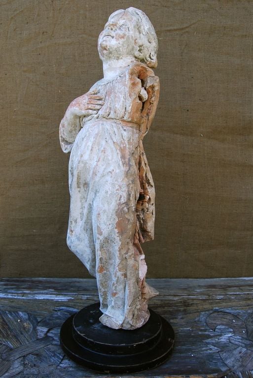 French Terracotta Statue of Bébé Jésus on Stand.  Once attached to a monastery in the South of France.  (Hence, the side of the statue missing.)